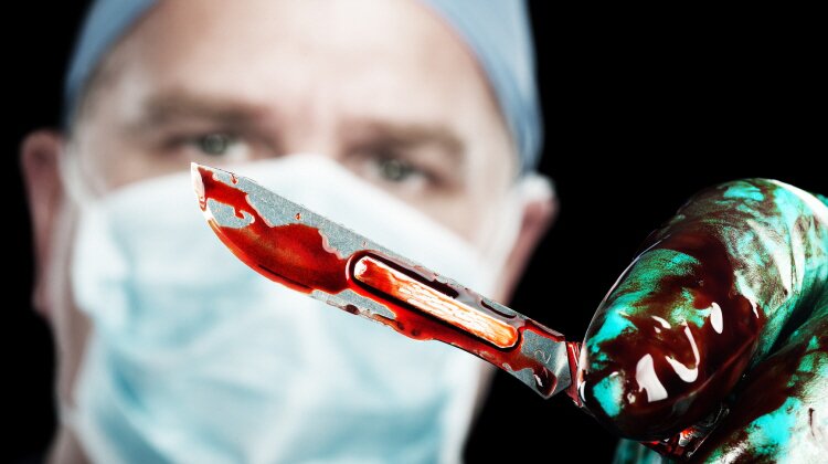 Surgeon with scalpel